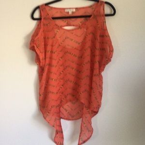 Sheer cold shoulder shirt.